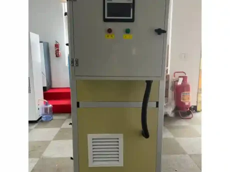 Workshop photo of Fengxing FXV Series vertical integrated single desiccant wheel dehumidifier, front touch screen control cabinet with start-stop emergency buttons, mobile wheel design for small workshop constant humidity